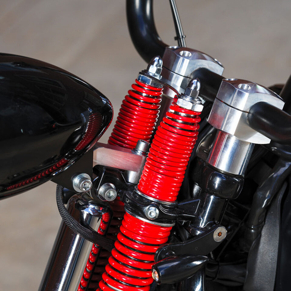 Crossbones Risers for Harley Davidson Springer models side view.