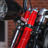 Headlight mount on Harley Davidson springer model.