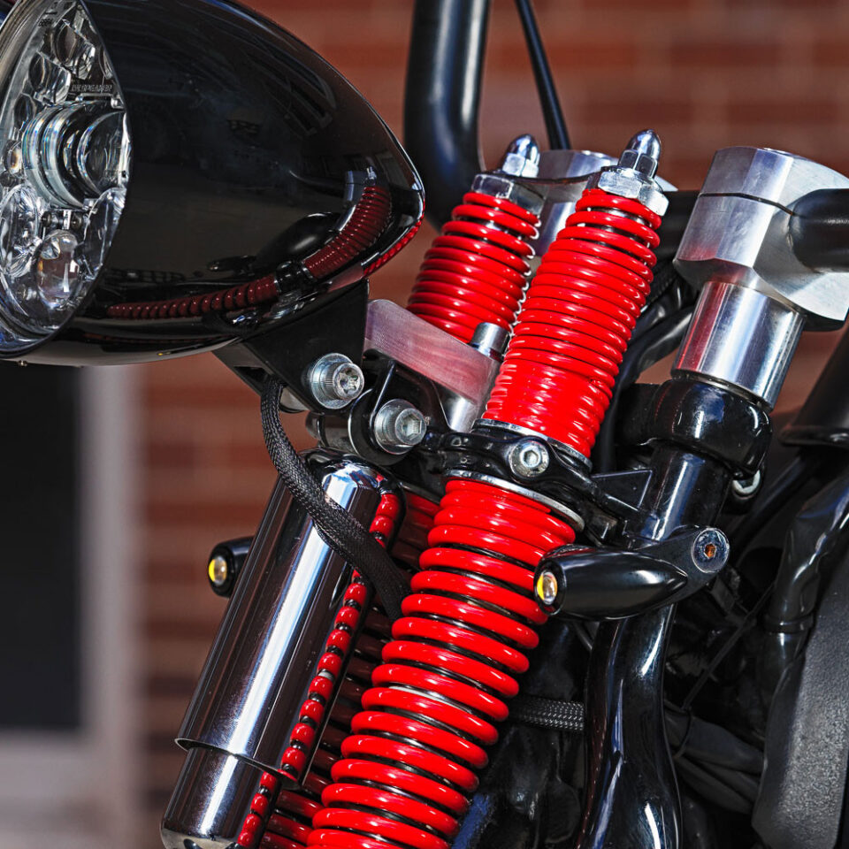 Headlight mount on Harley Davidson springer model.