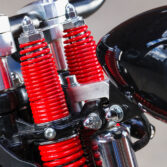 Headlight mount installed on Harley Davidson springer model.